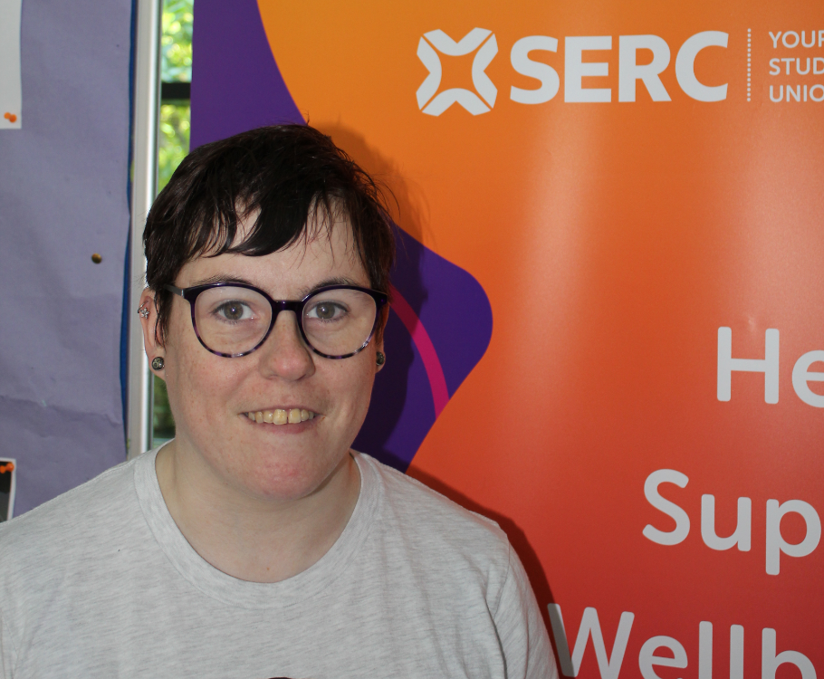 Student Sharon McCartney next to a poster for the SERC Students' Union